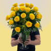 A generous cluster of bright yellow roses makes a bold, joyful statement-perfect