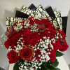 Bouquet of red roses with white baby's breath and butterfly accents