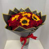 Bouquet of red roses and yellow sunflowers wrapped in black paper