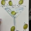 Playful olive characters gathered around a pale blue martini glass make this