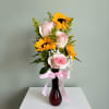 Bright, cheerful, and full of charm, this elegant vase arrangement features soft