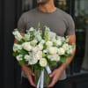 A graceful all-white arrangement crafted for sympathy and funeral moments, Angel Elegance
