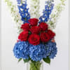 Bold red roses take center stage in this floral tribute to team