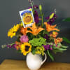 Bright, sunlit blooms burst from a white ceramic pitcher in this Summer