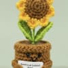 A handmade crocheted sunflower that doubles as a cheerful desk companion -