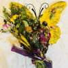 A playful butterfly-shaped flower arrangement that instantly feels like a celebration -