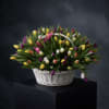 An abundant burst of joy&mdash;The Tulip Overflow features 100 fresh assorted tulips