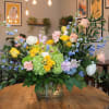 A lush, garden-style flower arrangement named after Ella, one of the talented