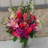 Pink and magenta mixed bouquet in a clear glass vase