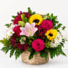 Bright pink roses and sunny yellow sunflowers make this cheerful flower arrangement