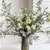 This arrangement is a large scale blooming wonderland. We favor flowers with
