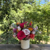 Gorgeous seasonal blooms in hot pink, light pink, orange, and purples. Some