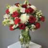 12 Red Roses with fillers on a vase 
Witch ever color you