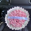 50 pink roses with baby&rsquo;s breath around it.