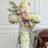 A serene white chrysanthemum cross for a funeral or sympathy arrangement offers