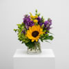 Sunflowers are accented with purple and green blooms