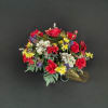 Colorful bouquet of red, white, yellow, and purple flowers with gold ribbon