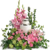 Surround the cremation urn with gorgeous, graceful pink blooms that show deep