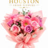 This arrangement is soft, feminine, and quietly celebratory. A delicate harmony of