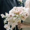 An elegant, romantic bouquet that features blush pink, creamy white, and soft