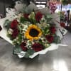 Bouquet of red roses and a sunflower with white flowers