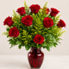 timeless arrangement of premium red roses accented with fresh greenery and arranged