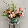 A fresh mix of bright, spring floral in a gorgeous blue ceramic