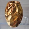 3D Metallic gold decorative vase with modern faceted accents