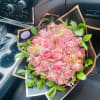Pink rose bouquet with green leaves and gold butterfly picks
