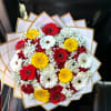Bouquet of red, yellow, and white gerbera daisies wrapped in white paper