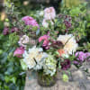 Grand and stunning, this showstopper is filled with green hydrangeas, viburnum, cafe