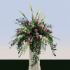 Tall and ceremonial, this Magenta and Calla flower arrangement is a sympathy