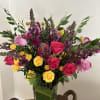 Mix of lively colored 2 dozen roses and various pom pom colors