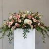 A beautiful and heartfelt tribute featuring soft blush roses, elegant pink lilies