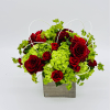 Red roses and green hydrangeas in a square gray container