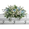 As soft and delicate as a tender remembrance, this stunning spray of