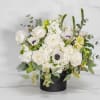 &ldquo;Diamonds and Pearls&rdquo; is an elegant white floral arrangement featuring lush roses