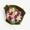 6 RED ROSES 
3 LILLIES STEM
Wrapping Paper will vary.