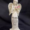 This beautiful resin angel statuette is 11'' inches tall and features a