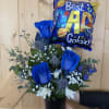 A striking Father&rsquo;s Day arrangement featuring vibrant blue roses, white accent blooms