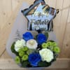 A thoughtful Father&rsquo;s Day bouquet featuring vibrant blue roses, soft white blooms