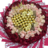 A lush ring of deep red roses frames a blushing center of