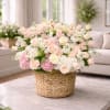 A soft, pastel statement for springtime celebrations-this rounded basket arrangement of roses