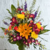 Mixed bouquet with orange lilies, yellow mums, and purple orchids