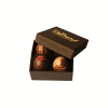 Box of assorted chocolate truffles with the lid open