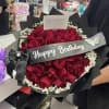 Bouquet of red roses with baby's breath and a Happy Birthday ribbon