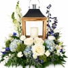 A cool, serene centerpiece built around a rustic wooden lantern creates a
