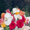 A vivid mix of hot pink, coral and bright yellow roses paired