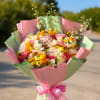 A cheerful and elegant arrangement in pastel tones, featuring a delicate blend