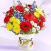 Bright, playful and full of cartoon charm, this flower arrangement makes an
